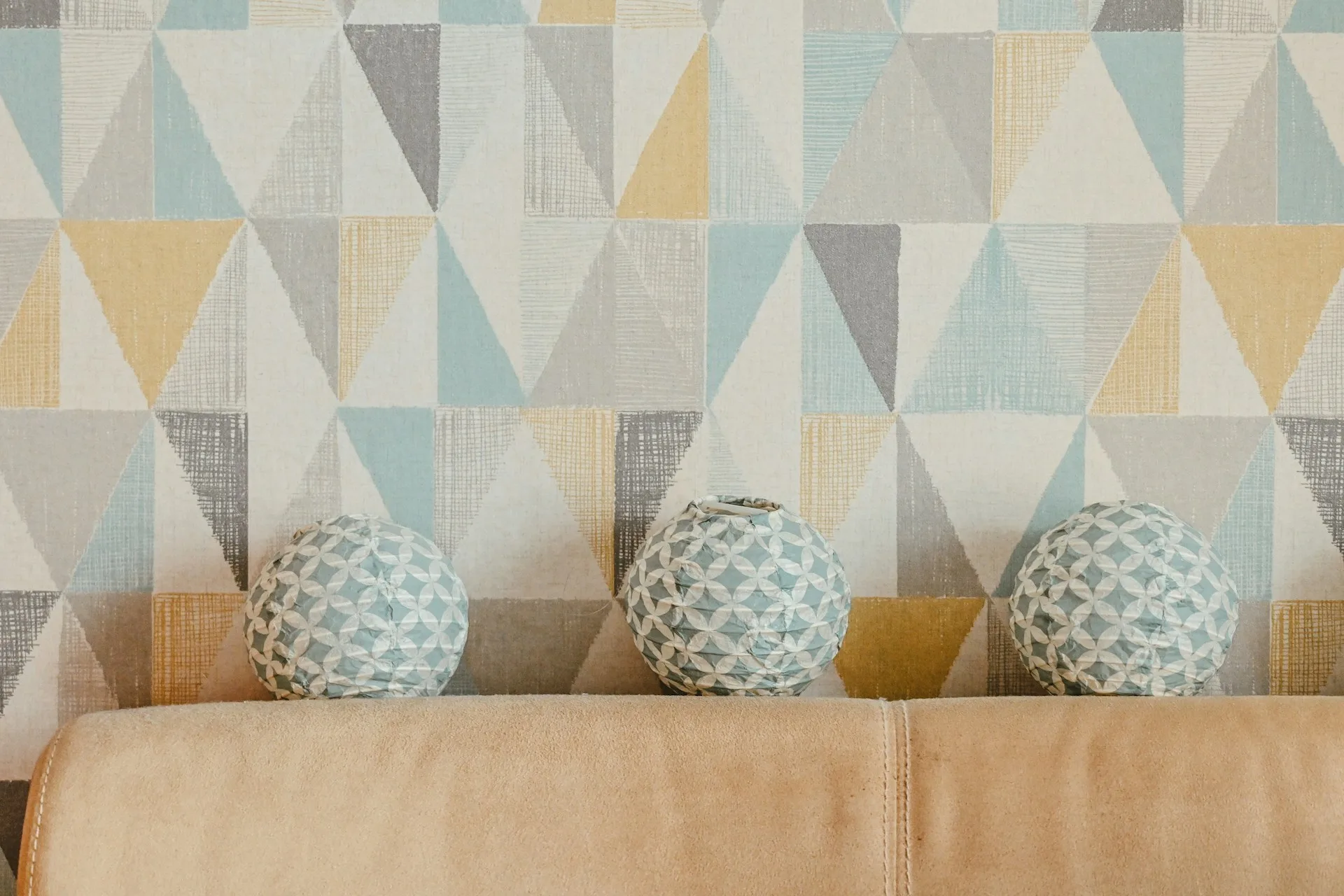 Textured wallpaper detail on historic plaster wall